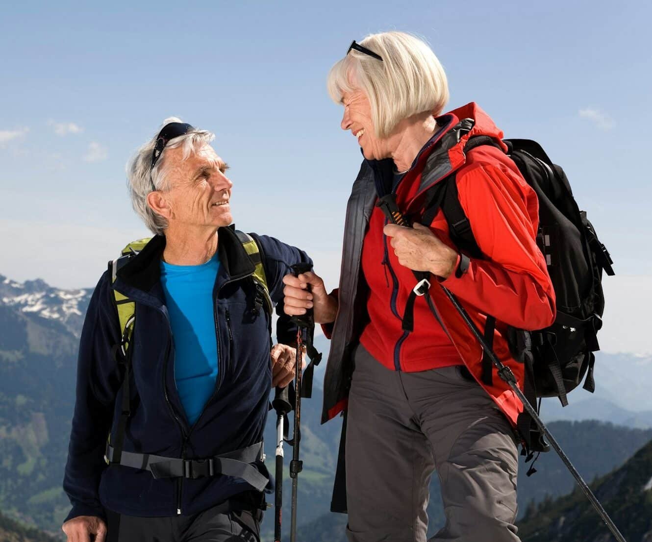 couple talking on ski tour in mountains